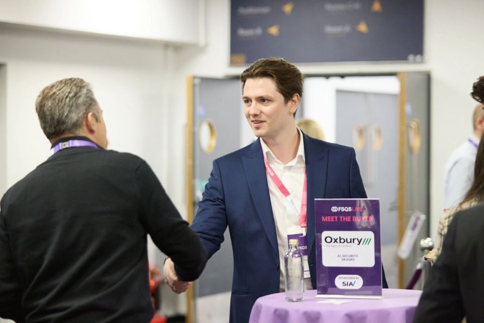 Cyber Security Recruiter shaking hands at an event